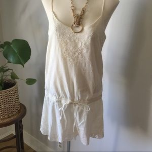Lightweight shorts romper with lace detailing.